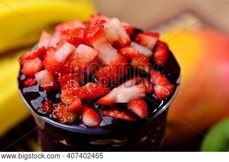 Acai Cup With Strawberry Topping Banana, Kiwi, Delicious Brazilian Açaí Creamy, Closeup View