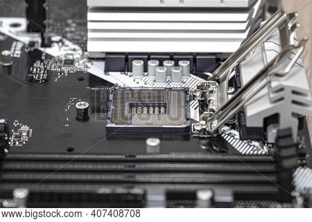 Macro Shot Of Empty Modern Lga 1200 Socket For Cpu On Black Desktop Motherboard.
