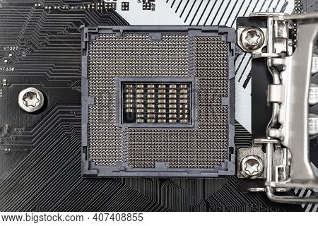 Top Macro Shot Of Empty Modern Lga 1200 Socket For Cpu On Black Desktop Motherboard.