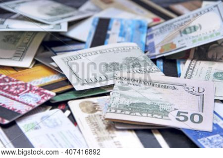 Banknotes With Credit Cards. Cash And Non-cash Money. U.s. Dollars. Fifty Dollars And Pile Of Credit