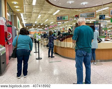 People Waiting In Line To Purchase Lottery Tickets At A Publix Grocery Store