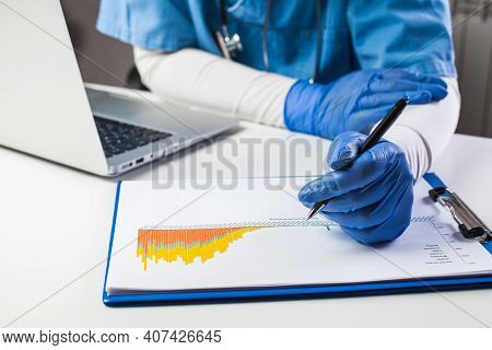 Doctor Wearing Protective Gloves Analyzing Covid-19 Info Data,coronavirus Global Pandemic Outbreak C