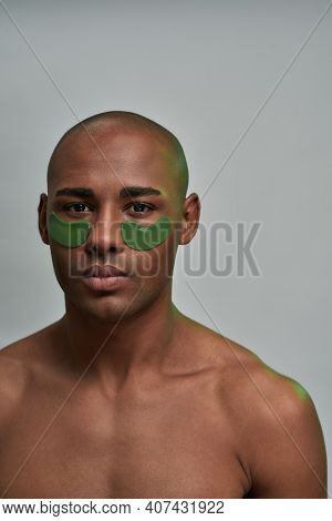 Green Eye Masks For Solving Eyebags Problem Above The Cheeks Of A Collected Strong Male
