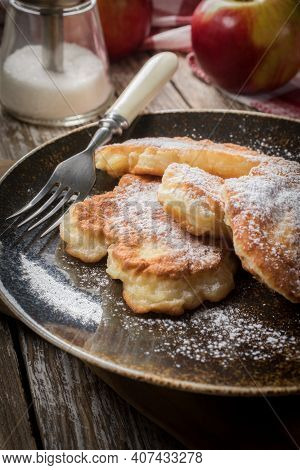 Sweet Pancakes Made Of Apple, Milk And Flour.