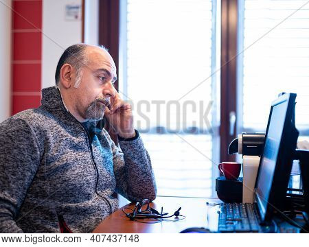A Middle Aged Caucasian Man Working From Home, Is Pissed Off And Feels Isolated. Concept Of Stressfu