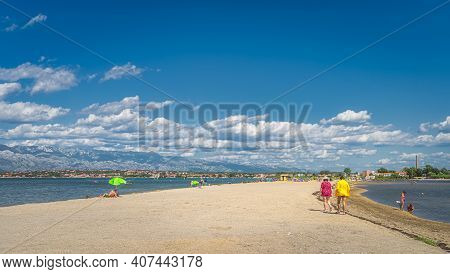 Nin, Croatia, July 2019 People, Tourists Relaxing On Zdrijac Beach Between Nin Bay And Adriatic Sea 