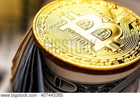 Golden Bitcoin Lies On The Banknotes.new Virtual Money. Crypto Currency Top View. Real Coins Of Bitc