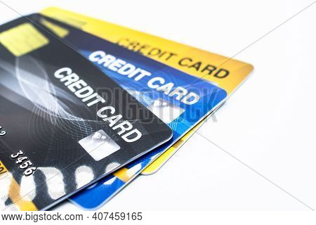 Close Up Of A Set Of Cradit Cards Isolated On White Background.  Credit Card Lets Cardholders Borrow