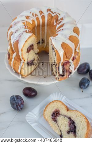 Typical German Poppy Seed Plum Gugelhupf Cake On A Table