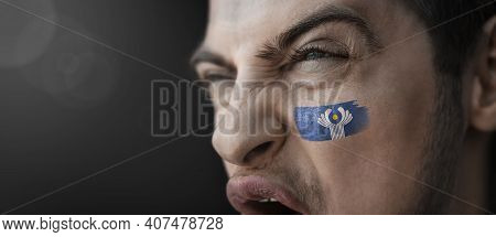 A Screaming Man With The Image Of The Cis National Flag On His Face