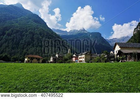 View On The Municipality Of Sonogno Over A Green Meadow