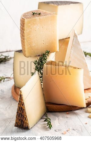 Cheese Board Of Various Types Of Soft And Hard Cheese. Spanish Manchego Cheese, International Dairy 
