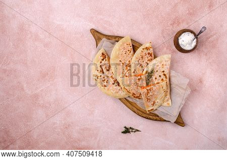 Baked Bread With Vegetable Filling On A Stone Background. Selective Focus.