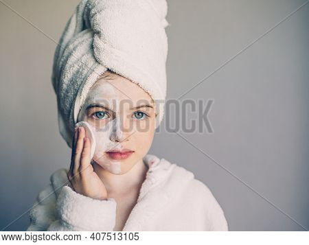 Funny Young Girl With A Mask For Skin Face