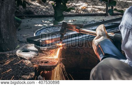 Close Up Hand Heavy Industrial Worker Is Working On Metal Work Factory Process By Cutting Sheet Stee