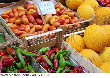 Colored Peppers, Yellow Melons, Red Long Cirio Tomatoes, Vegetable Products Laid Out On The Market, 
