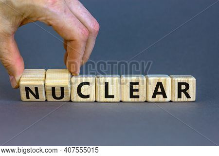 Nuclear Or Clear Symbol. Businessman Turns A Cube And Changes The Word 'nuclear' To 'clear'. Beautif