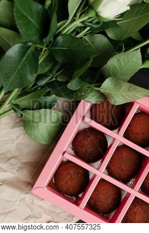 Truffle Candies In A Gift Box. Pink Box Of Chocolates And Flowers. A Gift Set For A Woman. A Gift Fo