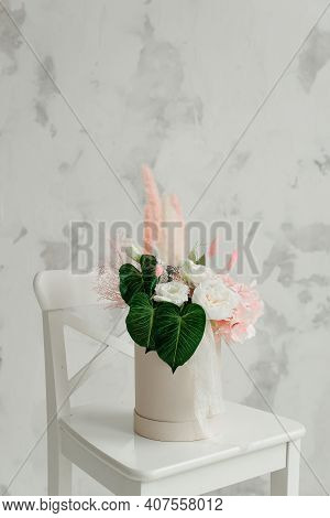 Flowers In A Round Luxury Gift Box. A Bouquet Of Pink And White Flowers In A Paper Box.