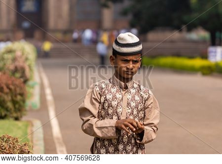 Vijayapura, Karnataka, India - November 8, 2013: Gol Gambaz Mausoleum. Closeup Of Young Boy With Whi