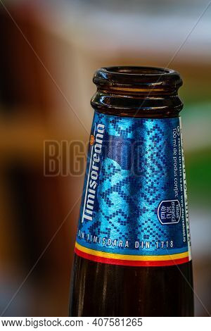 Romanian Timisoreana Beer Isolated, Close Up On Detail Of Glass Beer Bottle. Bucharest, Romania, 202