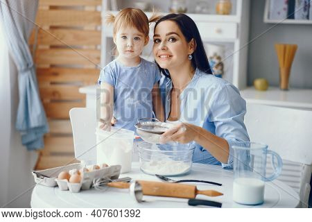Cute Family Prepare The Breakfest In A Kitchen