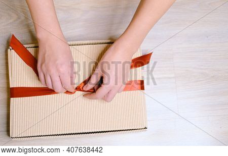 Female Hands Close-up, Holding A Gift In A Box With A Red Ribbon. Concept - Valentines Day, Womens Z