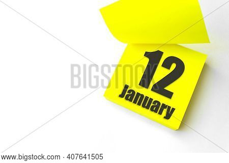 January 12nd. Day 12 Of Month, Calendar Date. Close-up Blank Yellow Paper Reminder Sticky Note On Wh