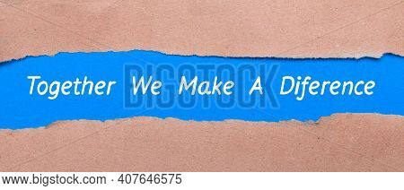 A Strip Of Blue Paper With The Words Together We Make A Difference Between The Brown Paper. View Fro