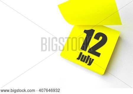 July 12nd. Day 12 Of Month, Calendar Date. Close-up Blank Yellow Paper Reminder Sticky Note On White