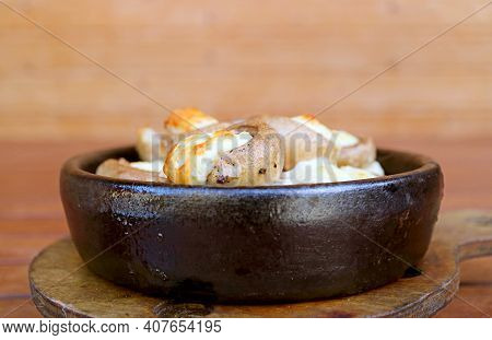 Delicious Georgian Stuffed Mushrooms With Sulguni Cheese Baked In A Ketsi Clay Dish Called Soko Ketz