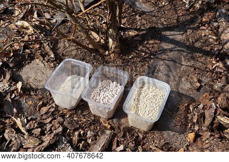 Three Fertilizer Containers, Three Different Types Of Fertilizer. Spring Fertilization Of Plants In 