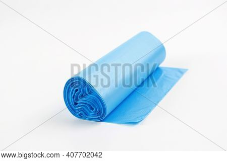 Roll Of Blue Plastic Bag For Garbage And Waste. A Mock-up Of A New, Unused Plastic Garbage Bag On A 