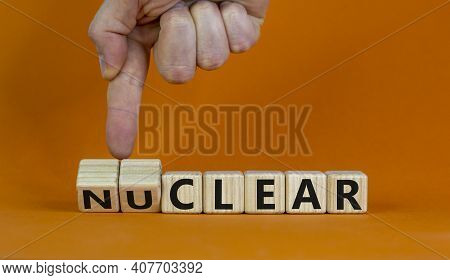 Nuclear Or Clear Symbol. Businessman Turns A Cube And Changes The Word 'nuclear' To 'clear'. Beautif