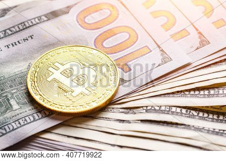 Golden Bitcoin Lies On The Banknotes.new Virtual Money. Crypto Currency Top View. Real Coins Of Bitc