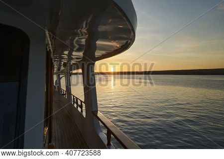 Beautiful And Spectacular Sunset Over A Motor Yacht With Reflections On The White Paint And Details 