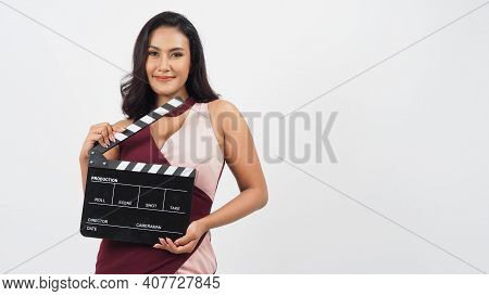 Asian Sexy Woman Hold Clapper Board Or Movie Slate Isolated On White Background.she Have Tan Skin ,s