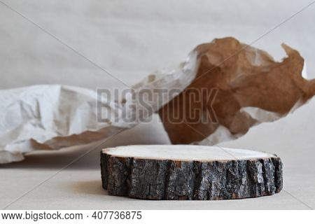 Podium For Product Presentation. A Minimalistic Scene Of A Felled Tree Against A Background Of Crump