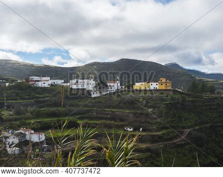 View Of Juncalillo Small Village With Chuch In Rural Landscape With Green Hills, And Terraced Fields