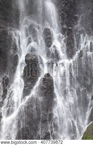 View Of The Fresh, Noisy And Intense Water In Tumpak Sewu Waterfall, In East Java, Indonesia.