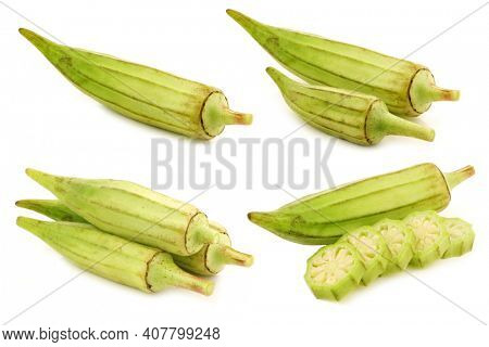 fresh raw okra pods (Abelmoschus esculentus) and a cut one on a white background