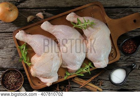 Fresh Chicken Meat With Rosemary And Spices On Wooden Board.