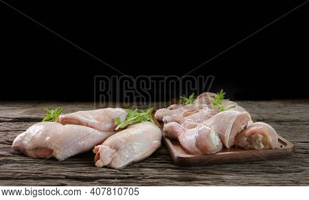 Fresh Chicken Meat With Rosemary And Spices On Wooden Board.