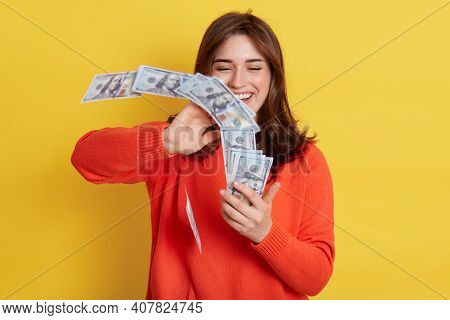 Woman Throws Up In Air Cash, Laughing Happily, Holding Big Sum Of Money, Having Reward For Job, Wear