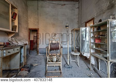 November 2020, Italy. Old Dentist\\\'s Office Of A Country Doctor, With A Dental Chair And Lockers W