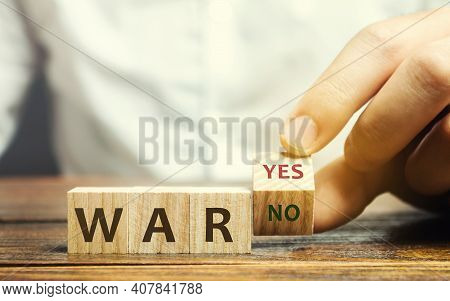 Wooden Blocks With The Words War, Yes And No. Conflict Between Political States And Factions. Armed 