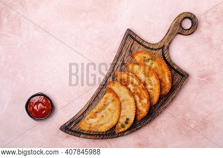 Fried Burekas With Filling On A Light Stone Background. Top View. Selective Focus.