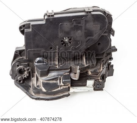 Detail Of A Car Spare Part Made Of Black Plastic And Metal - Door Lock Separately Isolated On A Whit