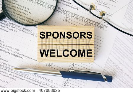 Wooden Blocks With Text Sponsors Welcome On Financial Docs