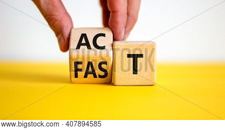 Time To Act Fast Symbol. Businessman Turns A Wooden Cube With Words 'act Fast'. Beautiful Yellow Tab